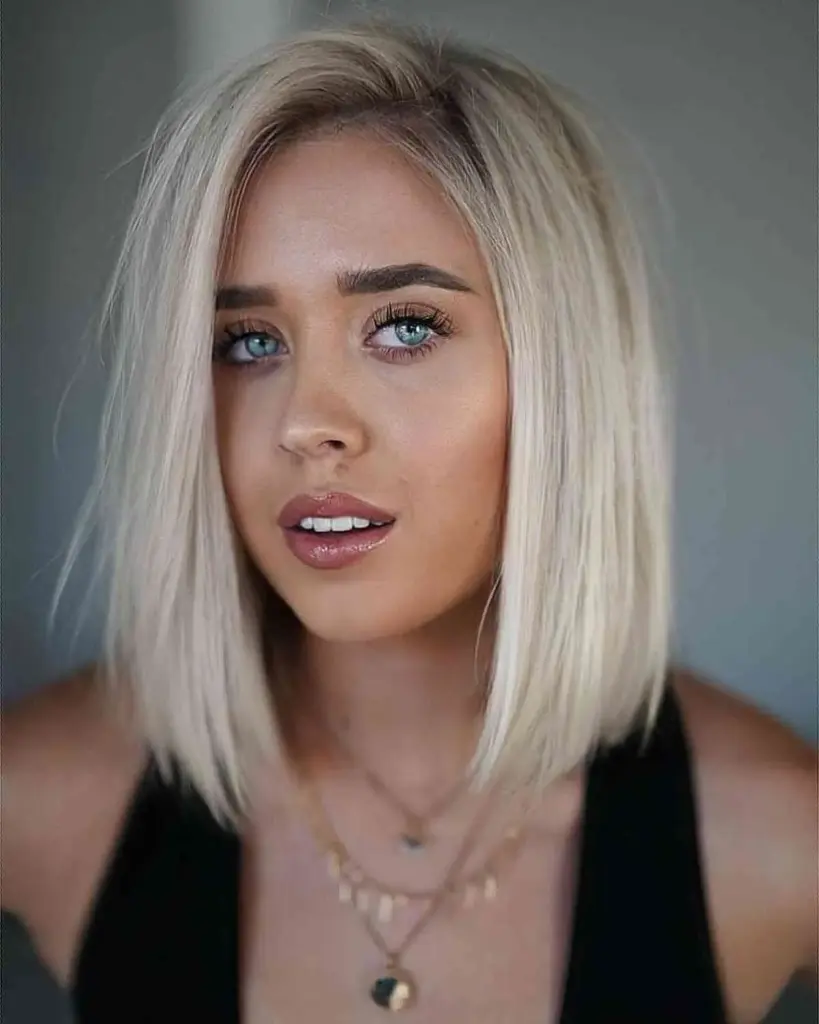 Blunt lob do ramena s nevidljivim slojevima, elegantna frizura za ovalno lice