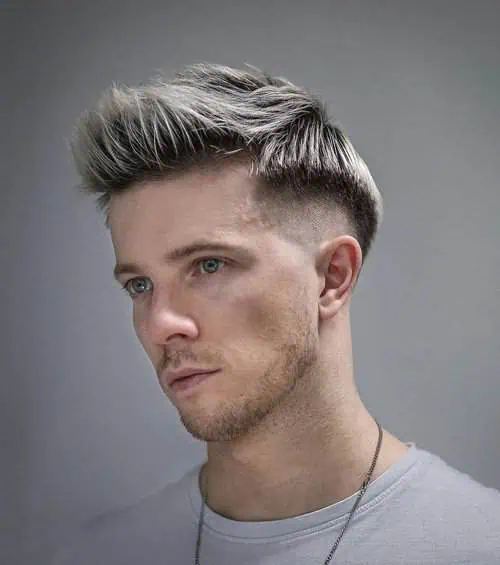 Polupodignuta frizura koja naglašava oči i uravnotežuje čelo i bradu kod duguljastog lica.